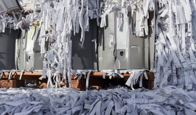 Image showing shredder machines with shredded papers