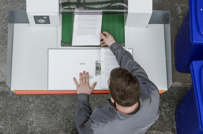 Image showing a man taking printouts